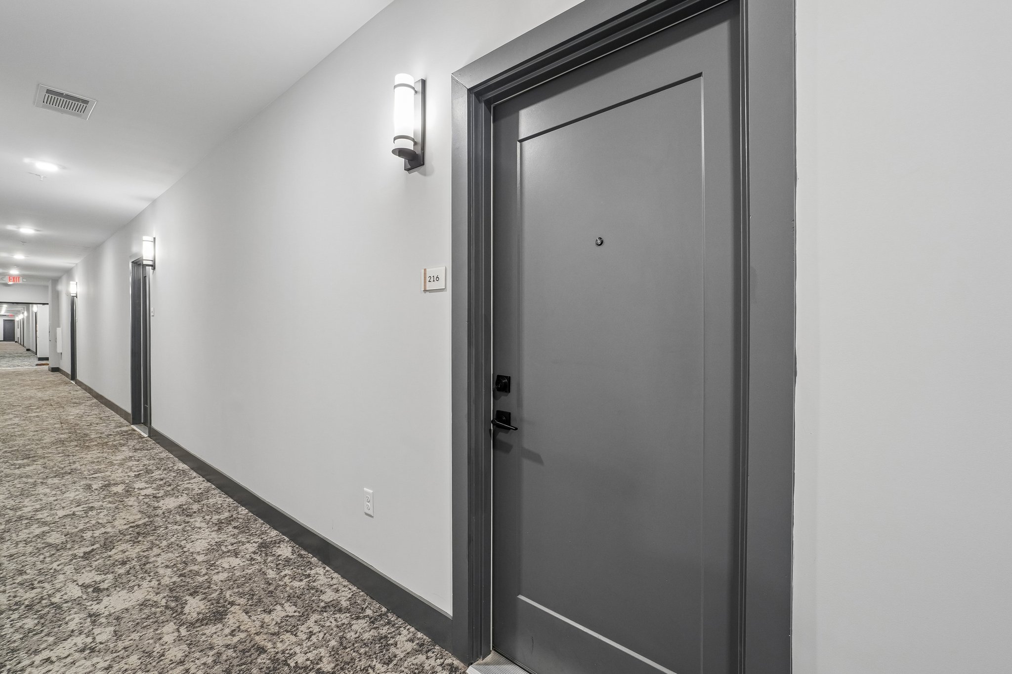 Hallway and apartment entrance at The Avery
