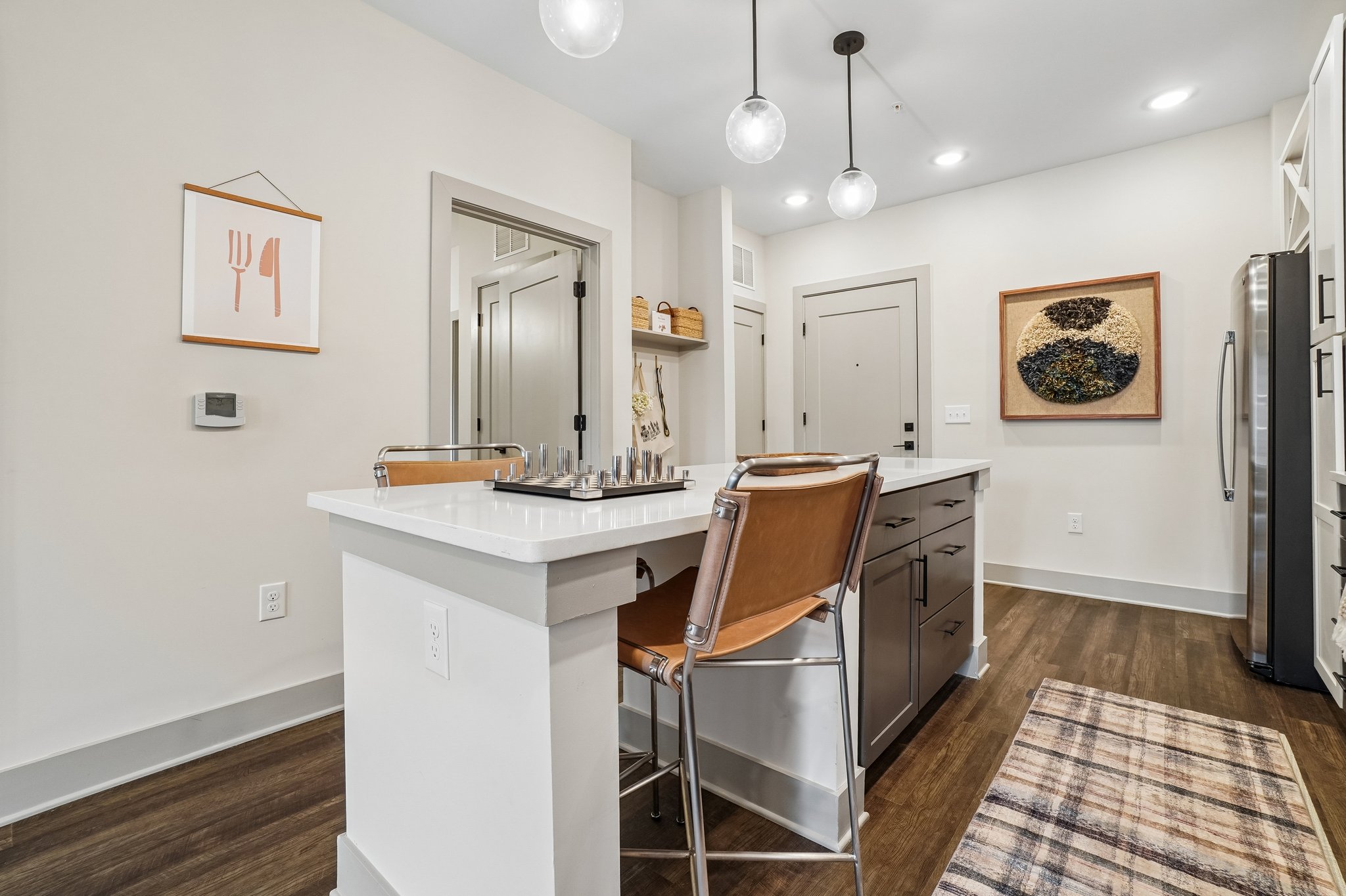 Kitchen island with seating in a model apartment at The Avery
