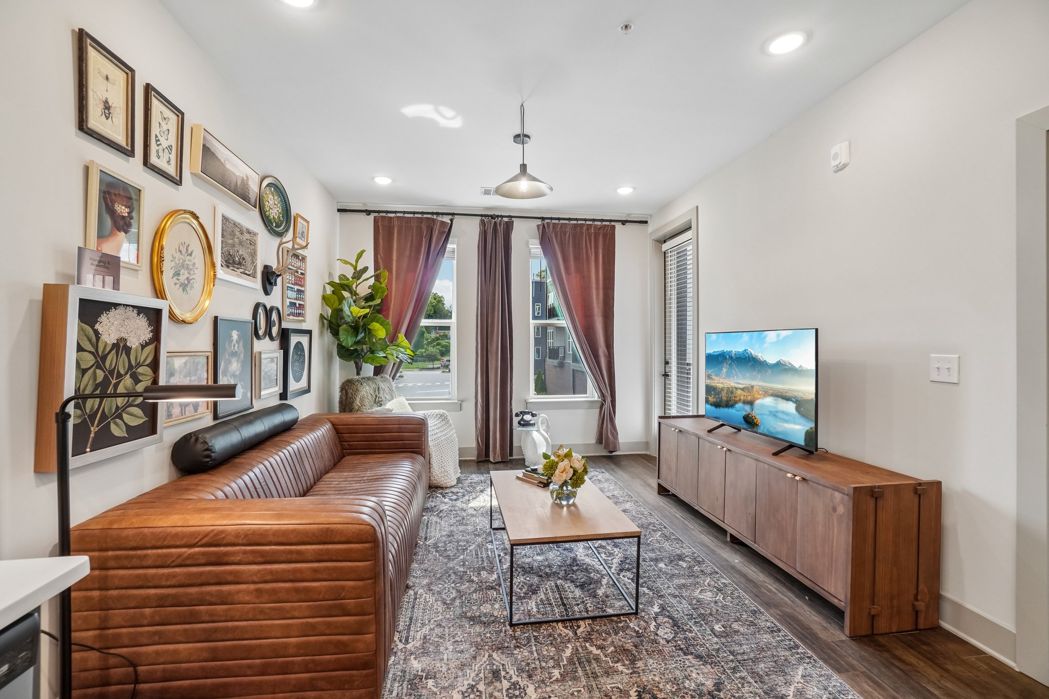 Living room of a model apartment home with luxury vinyl plank flooring