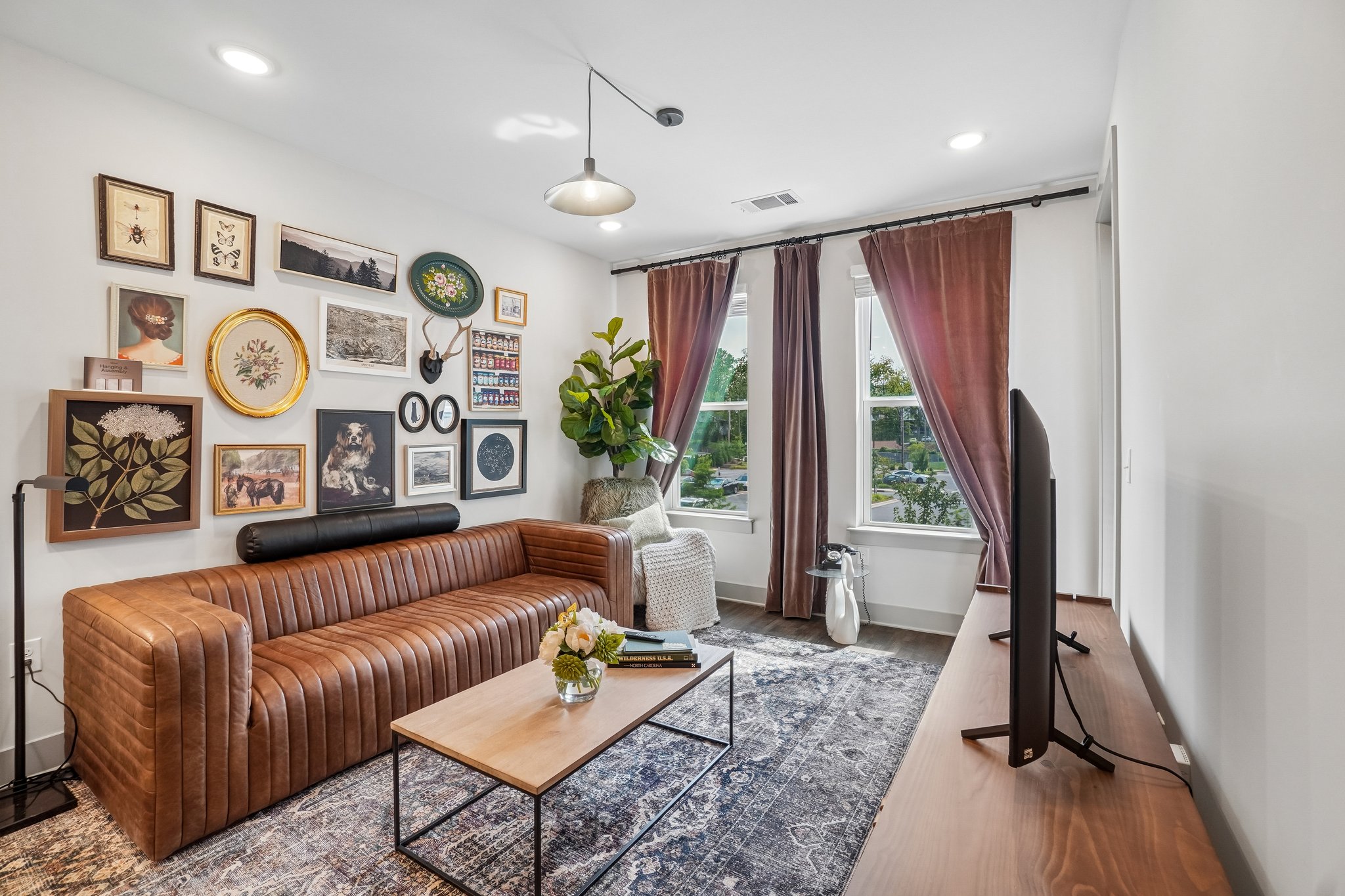 Stylish model living room with large windows